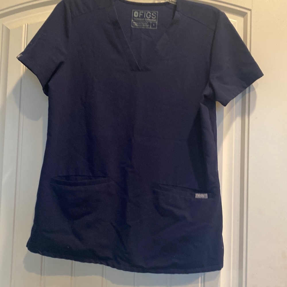 Navy scrub top in good used condition.